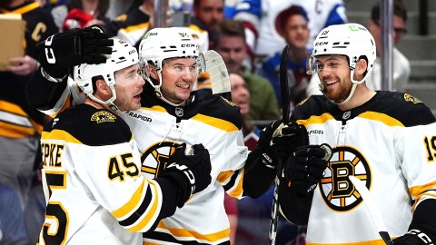 Boston Bruins forwards Cole Koepke and Johnny Beecher and defenseman Andrew Peeke