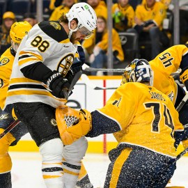 Boston bruins forward David Pastrnak and Nashville Predators goalie Juuse Saros