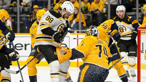 Boston bruins forward David Pastrnak and Nashville Predators goalie Juuse Saros