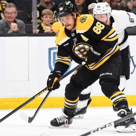 Boston Bruins forward David Pastrnak and Los Angeles Kings defenseman Vladislav Gavrikov