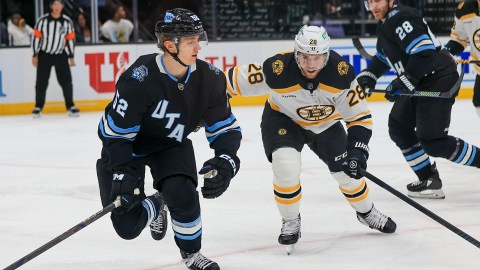 Boston Bruins forward Elias Lindholm and Utah Hockey Club forward Alexander Kerfoot