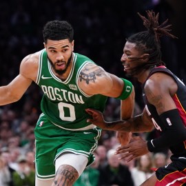 Boston Celtics forward Jayson Tatum and Milwaukee Bucks guard Delon Wright