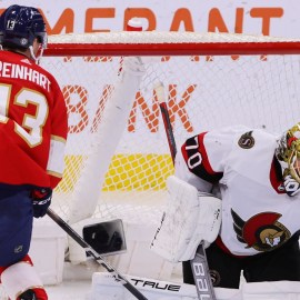 Boston Bruins goaltender Joonas Korpisalo and Florida Panthers forward Sam Reinhart