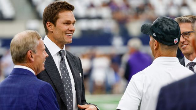 Former NFL quarterback Tom Brady and Baltimore Ravens head coach John Harbaugh