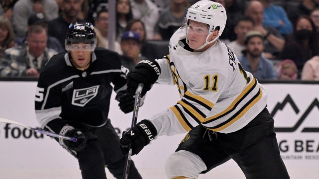 Boston Bruins forward Trent Frederic and Los Angeles Kings forward Quinton Byfield