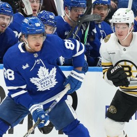 Boston Bruins forward Trent Frederic and Toronto Maple Leafs forward William Nylander