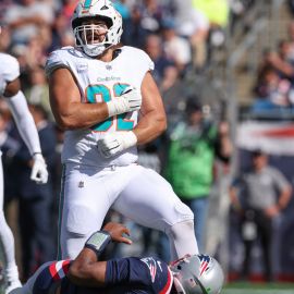 Miami Dolphins defensive tackle Zach Sieler and New England Patriots quarterback Jacoby Brissett