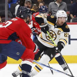 Boston Bruins left wing Brad Marchand, Washington Capitals defenseman Matt Roy