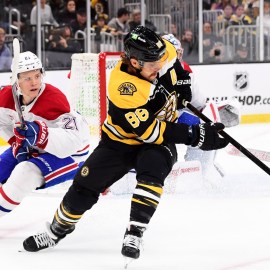 Boston Bruins forward David Pastrnak, Montreal Canadiens defenseman Kaiden Guhle