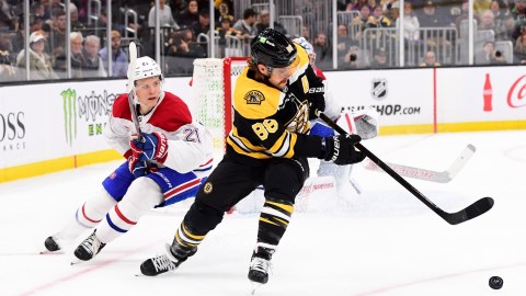 Boston Bruins forward David Pastrnak, Montreal Canadiens defenseman Kaiden Guhle