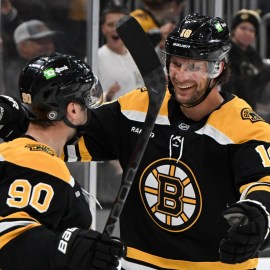 Boston Bruins forwards Tyler Johnson, Pavel Zacha