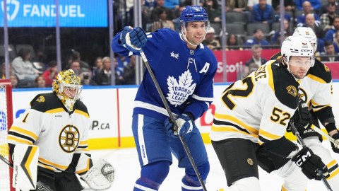 Boston Bruins defenseman Andrew Peeke and goaltender Jeremy Swayman and Toronto Maple Leafs forward John Tavares