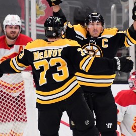 Boston Bruins forward Brad Marchand and defenseman Charlie McAvoy