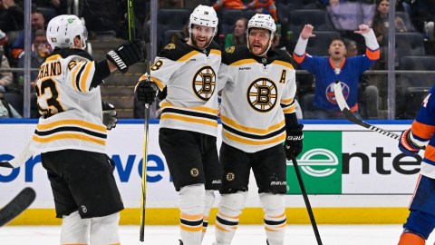 Boston Bruins teammates Brad Marchand, Pavel Zacha and David Pastrnak