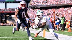 New England Patriots cornerback Christian Gonzalez and Miami Dolphins wide receiver Tyreek Hill