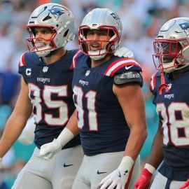 New England Patriots tight ends Hunter Henry and Austin Hooper and running back Rhamondre Stevenson