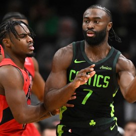 Boston Celtics guard Jaylen Brown and Toronto Raptors guard Davion Mitchell