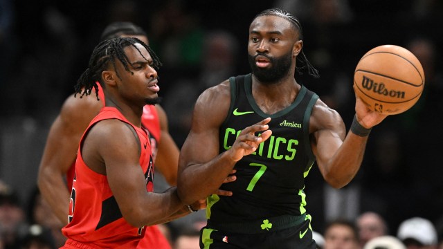 Boston Celtics guard Jaylen Brown and Toronto Raptors guard Davion Mitchell