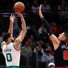 Boston Celtics forward Jayson Tatum and Chicago Bulls center Nikola Vucevic