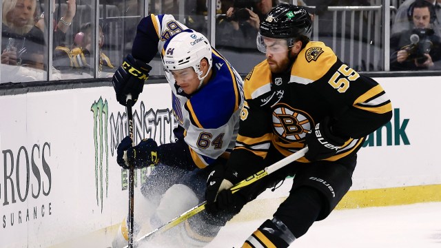 Boston Bruins forward Justin Brazeau and St. Louis Blues defenseman Corey Schueneman