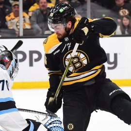 Boston Bruins forward Justin Brazeau and Utah Hockey Club goaltender Karel Vejmelka