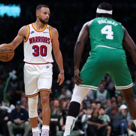 Golden State Warriors guard Stephen Curry and Boston Celtics guard Jrue Holiday