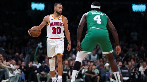 Golden State Warriors guard Stephen Curry and Boston Celtics guard Jrue Holiday