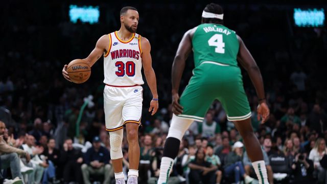 Golden State Warriors guard Stephen Curry and Boston Celtics guard Jrue Holiday