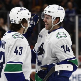 Vancouver Canucks forward Jake DeBrusk, defenseman Quinn Hughes