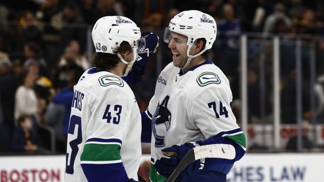 Vancouver Canucks forward Jake DeBrusk, defenseman Quinn Hughes