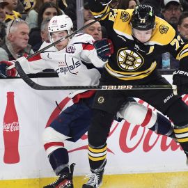 Washington Capitals forward Andrew Mangiapane and Boston Bruins defenseman Charlie McAvoy