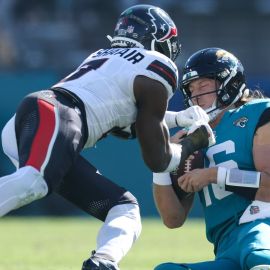 Houston Texans linebacker Azeez Al-Shaair and Jacksonville Jaguars quarterback Trevor Lawrence