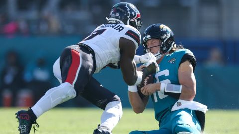 Houston Texans linebacker Azeez Al-Shaair and Jacksonville Jaguars quarterback Trevor Lawrence