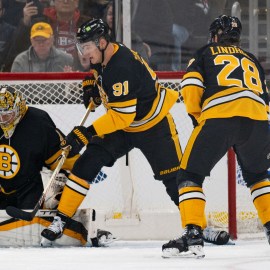 Boston Bruins goaltender Jeremy Swayman, defenseman Nikita Zadorov and forward Elias Lindholm