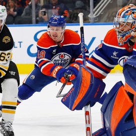 Boston Bruins forward Brad Marchand and Edmonton Oilers goaltender Stuart Skinner