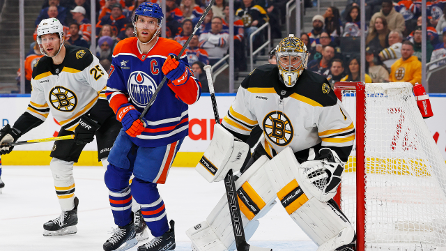 Boston Bruins goaltender Jeremy Swayman and defenseman Brandon Carlo, Edmonton Oilers forward Connor McDavid