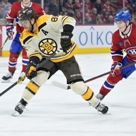 Boston Bruins forward David Pastrnak and Montreal Canadiens forward Cole Caufield