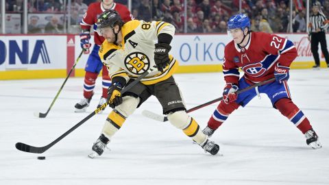 Boston Bruins forward David Pastrnak and Montreal Canadiens forward Cole Caufield