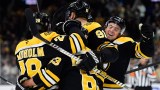 Boston Bruins forwards Elias Lindholm and Brad Marchand, defensemen Nikita Zadorov and Charlie McAvoy