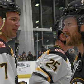 Former Boston Bruins defenseman Kevan Miller and Warrior For Life Fund All-Stars defenseman Nick Franze