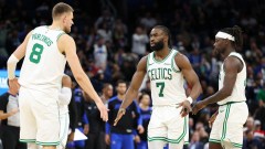 Boston Celtics teammates Kristaps Porzingis, Jaylen Brown and Jrue Holiday