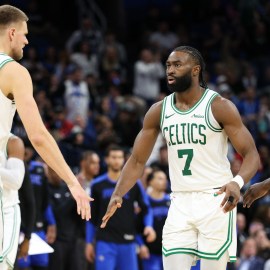 Boston Celtics teammates Kristaps Porzingis, Jaylen Brown and Jrue Holiday