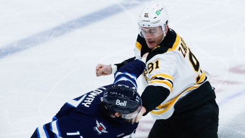 Boston Bruins defenseman Nikita Zadorov and Winnipeg Jets forward Adam Lowry