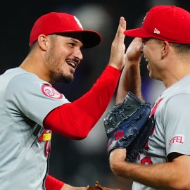 St. Louis Cardinals third baseman Nolan Arenado and pitcher Ryan Helsley