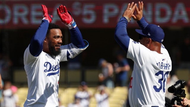 Los Angeles Dodgers manager Dave Roberts and MLB outfielder Teoscar Hernández