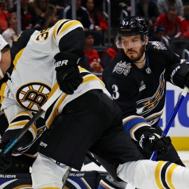 Boston Bruins forward Morgan Geekie, Washington Capitals defenseman Matt Roy