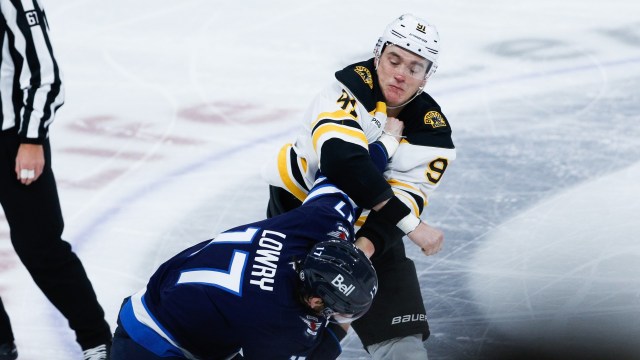 Boston Bruins defenseman Nikita Zadorov, Winnipeg Jets forward Adam Lowry