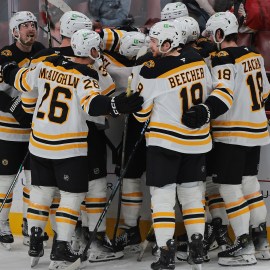 Boston Bruins celebrate on ice.