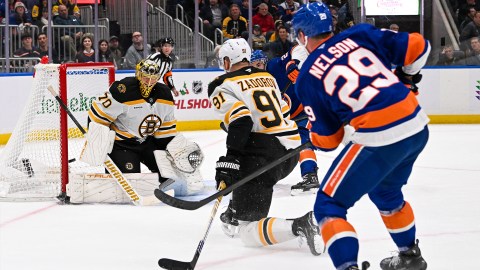 Bruins Goalie Joonas Korpisalo and Defenseman Nikita Zadorov and Islanders Forward Brock Nelson.