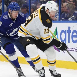 Boston Bruins forward Charlie Coyle and Tampa Bay Lightning defenseman Emil Lilleberg